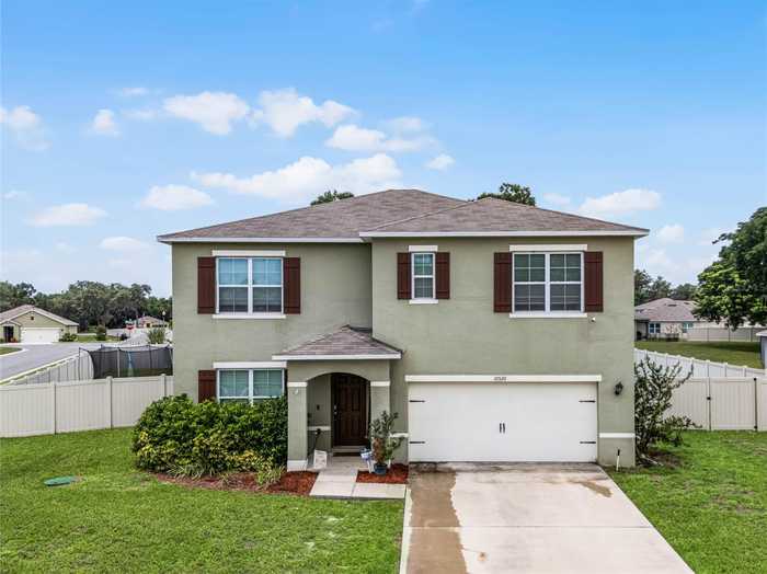 photo 1: 10520 BRONZE LEAF COURT, LEESBURG FL 34788