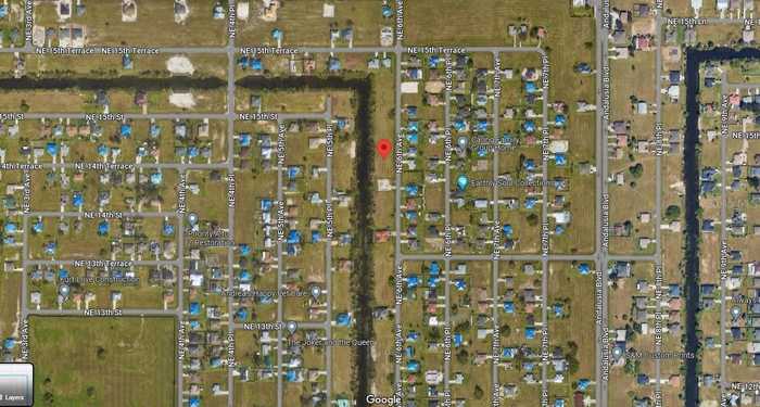 photo 1: 1418 NE 6TH, CAPE CORAL FL 33909