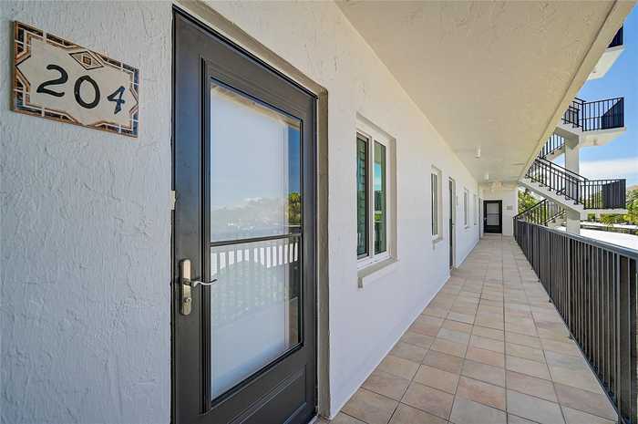 photo 2: 8897 MIDNIGHT PASS ROAD Unit 204, SARASOTA FL 34242