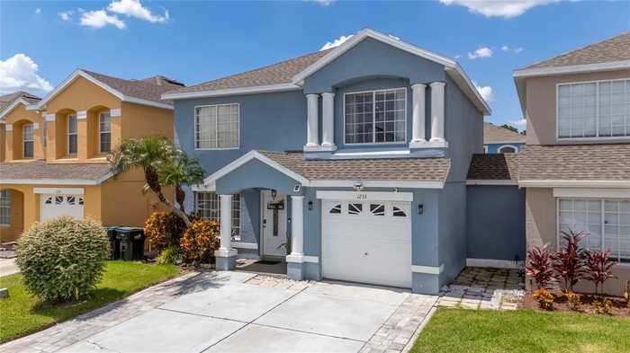 photo 1: 1233 SANDBROOK DRIVE, ORLANDO FL 32824