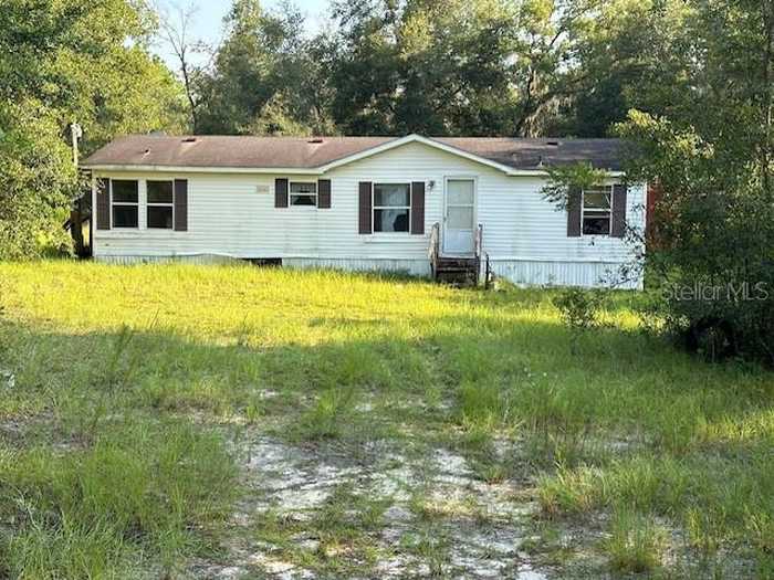 photo 1: 28430 SW 97TH LANE, NEWBERRY FL 32669