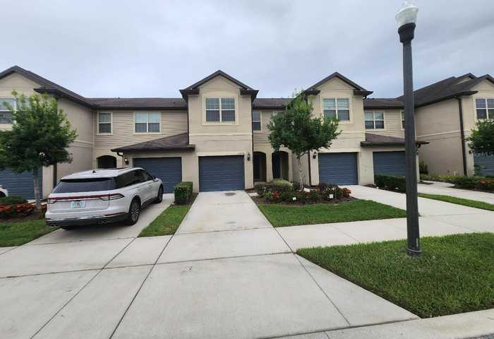 photo 1: 10859 CORSICAN STREET Unit 18, ORLANDO FL 32824