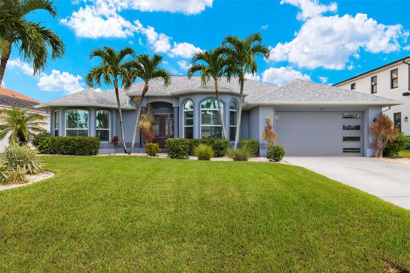 photo 1: 703 NW 39TH AVENUE, CAPE CORAL FL 33993