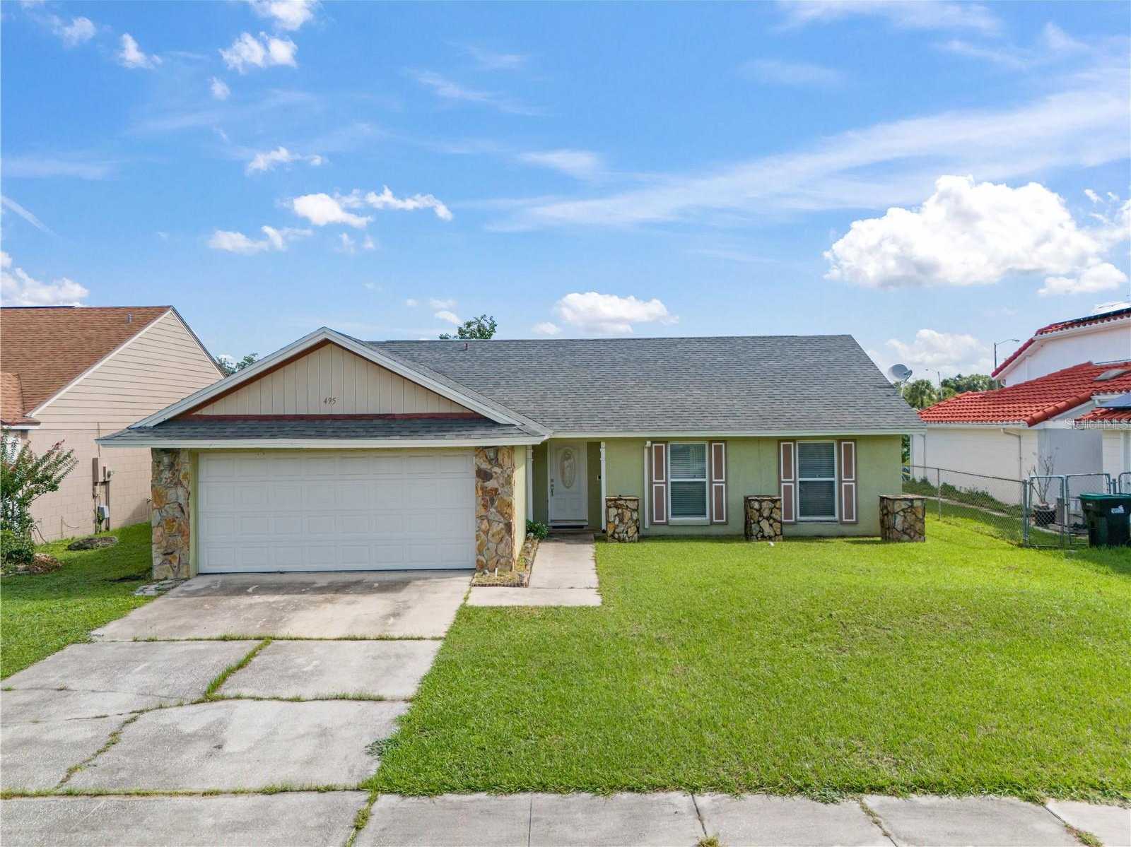 photo 1: 495 CHICAGO WOODS CIRCLE, ORLANDO FL 32824