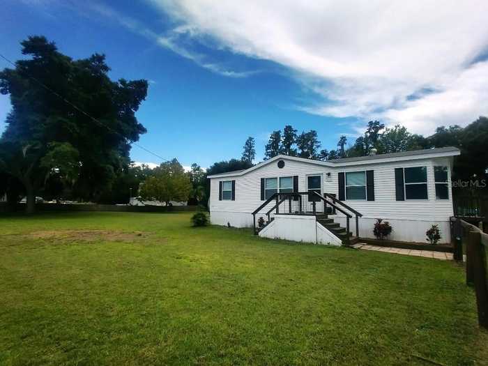 photo 1: 9018 HAMMOCK LOOP, POLK CITY FL 33868