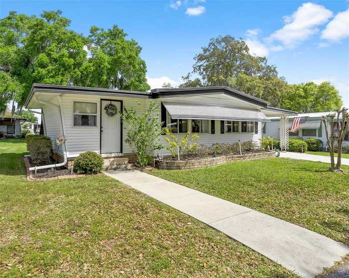 photo 1: 203 JACARANDA DRIVE, LEESBURG FL 34748