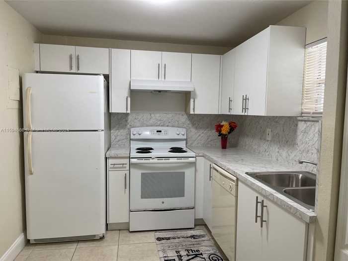 photo 1: 4205 N University Dr Unit 212, Sunrise FL 33351