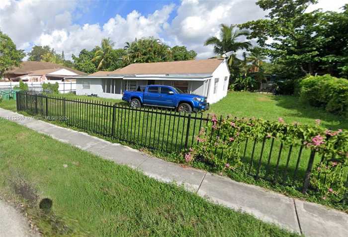 photo 1: 1235 NW 100th St, Miami FL 33147