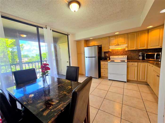 photo 1: 8420 SW 133rd Ave Rd Unit 419, Miami FL 33183