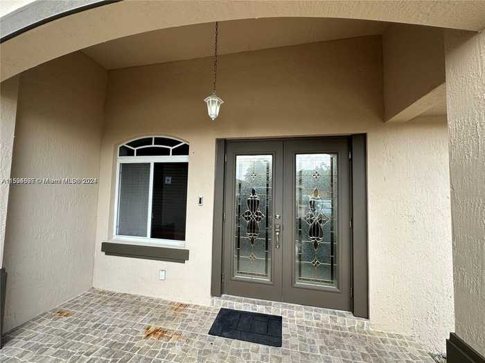 photo 1: 3783 NW 201st Ter, Miami Gardens FL 33055