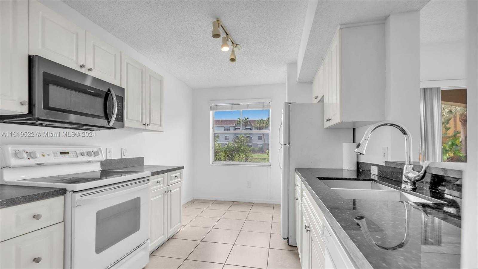 photo 1: 9650 NW 2nd St Unit 4-108, Pembroke Pines FL 33024