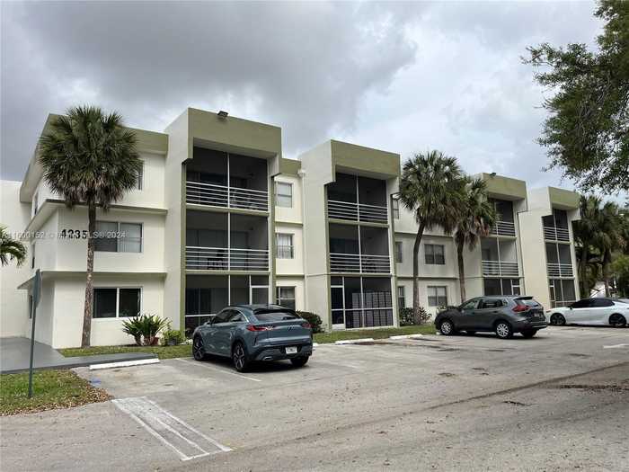 photo 1: 4235 N University Dr Unit 203, Sunrise FL 33351