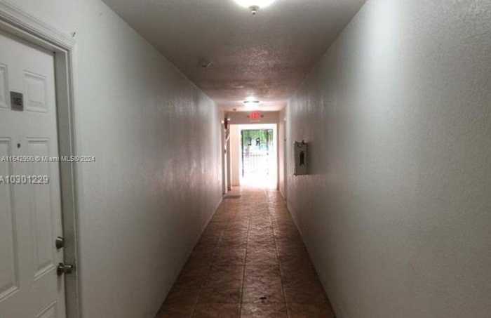 photo 2: 1021 NW 3rd St Unit 104, Miami FL 33128