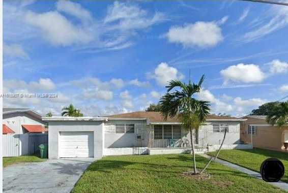 photo 1: 1061 NW 87th St, Miami FL 33150