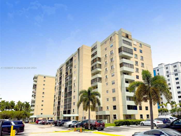 photo 1: 5055 NW 7th St Unit 207, Miami FL 33126