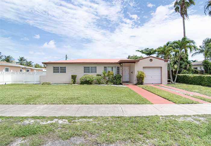 photo 1: 1050 NE 170th Ter, North Miami Beach FL 33162