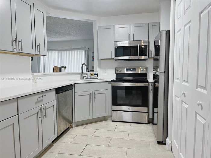 photo 1: 3461 NW 44th St Unit 106, Oakland Park FL 33309