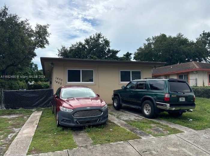 photo 1: 1460 NW 52nd St, Miami FL 33142