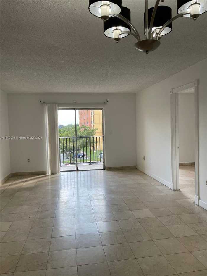 photo 1: 4721 NW 7th St Unit 305-12, Miami FL 33126