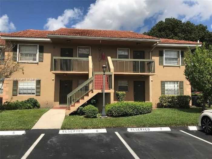 photo 1: 10457 NW 8th St Unit 105, Pembroke Pines FL 33026