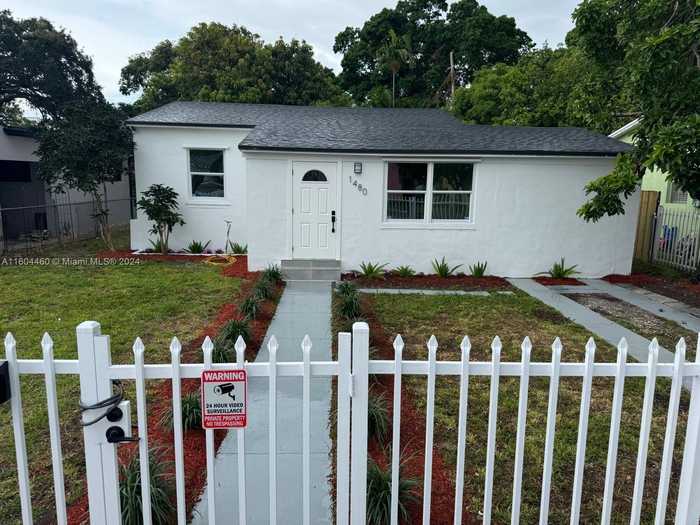 photo 1: 1480 NW 56th St, Miami FL 33142