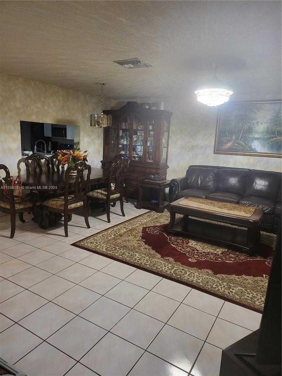 photo 1: 10877 NW 8th St Unit 10877, Pembroke Pines FL 33026