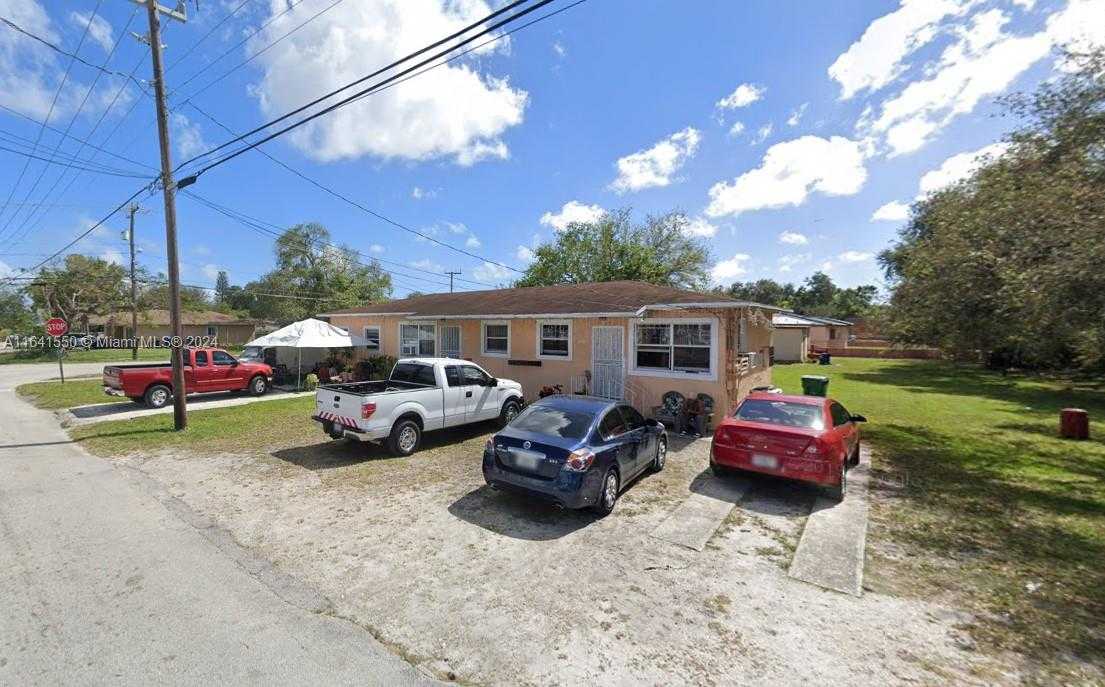 photo 1: 2400 NW 61st St, Miami FL 33142