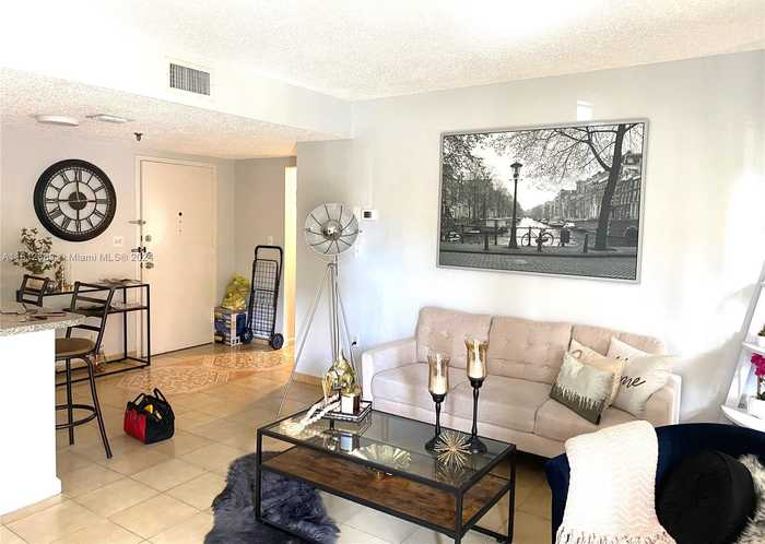 photo 1: 5249 NW 7th St Unit 117, Miami FL 33126