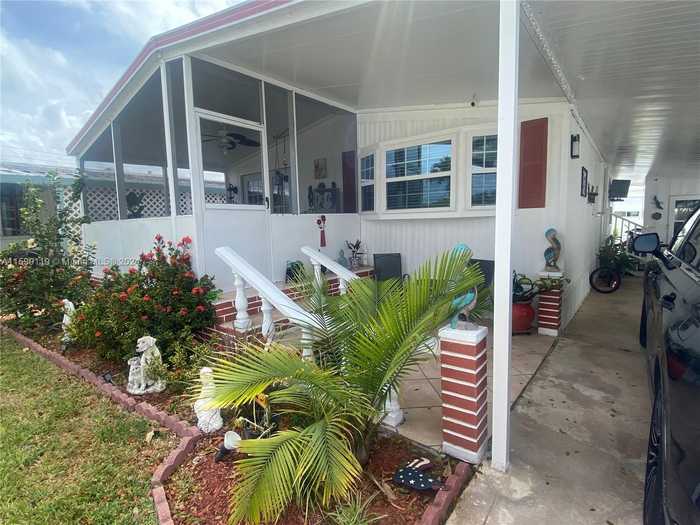 photo 1: 5261 SW 22nd Ter, Dania Beach FL 33312