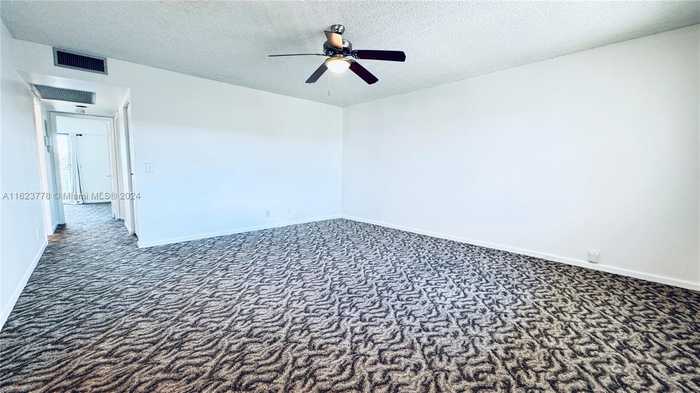 photo 1: 13250 SW 7th Ct Unit 402L, Pembroke Pines FL 33027