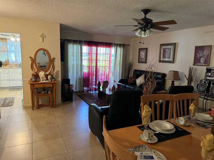 photo 1: 4047 NW 16th St Unit 110, Lauderhill FL 33313