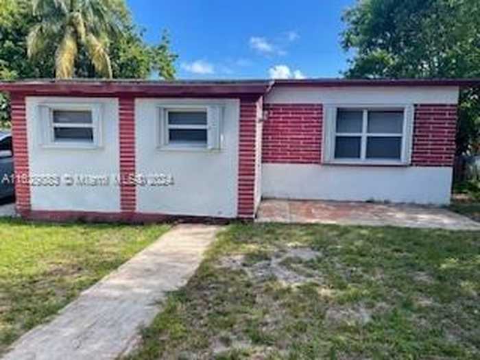 photo 1: 1235 NW 118th St, Miami FL 33167