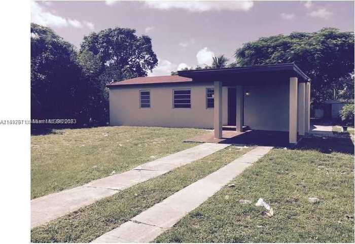 photo 1: 1680 NW 129th St, North Miami FL 33167