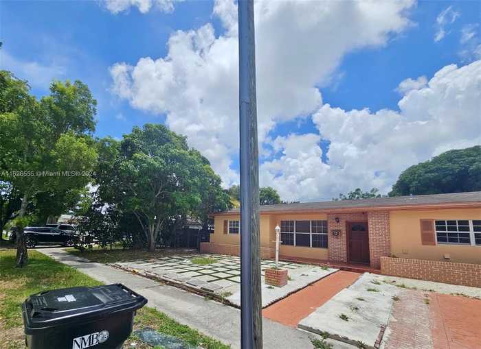 photo 1: 1020 NE 179th St, North Miami Beach FL 33162