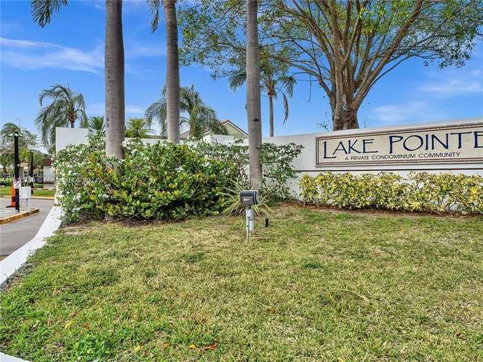 photo 1: 213 Lake Pointe Dr Unit 108, Oakland Park FL 33309