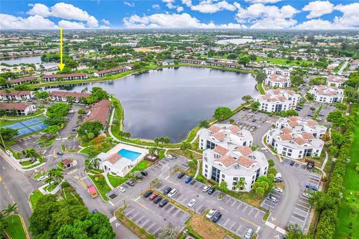 photo 1: 203 Lake Pointe Dr Unit 105, Oakland Park FL 33309