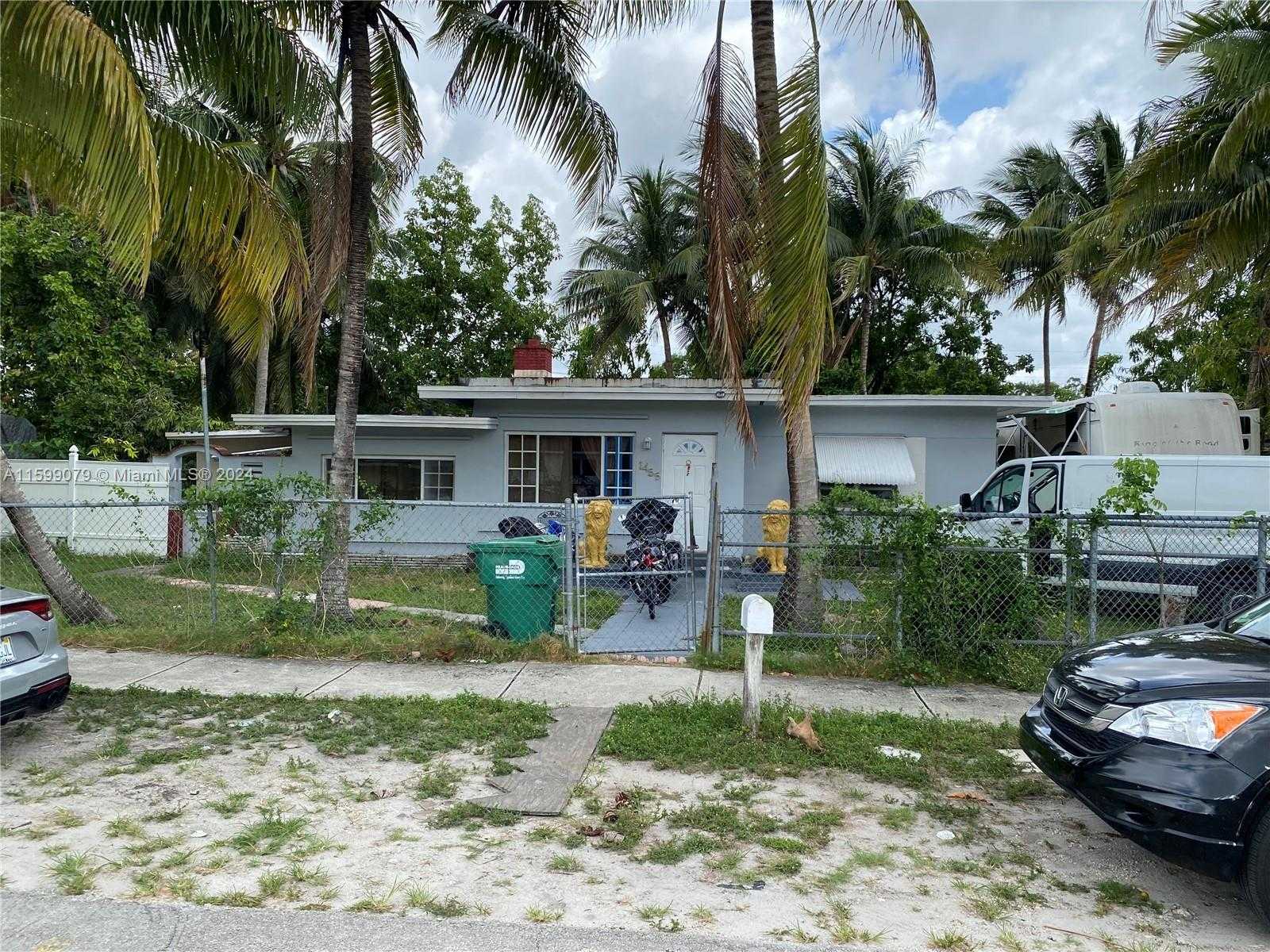 photo 1: 1455 NW 112th St, Miami FL 33167