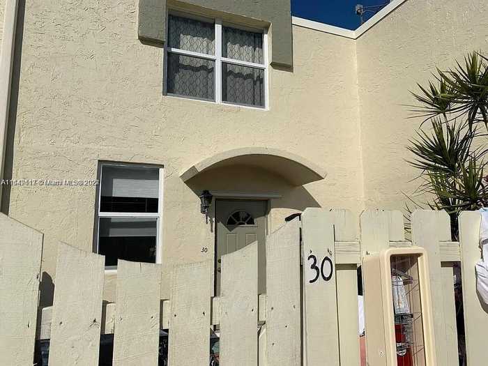 photo 1: 1651 NE 115th St Unit 30C, Miami FL 33181