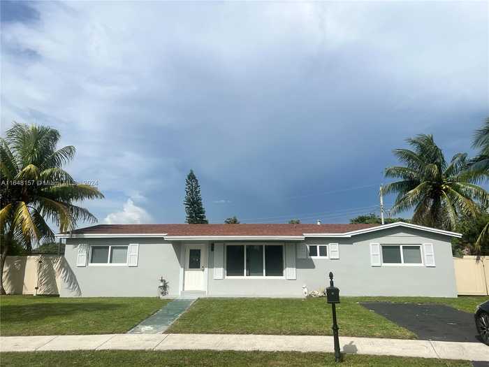 photo 1: 20505 NW 25th Ct, Miami Gardens FL 33056