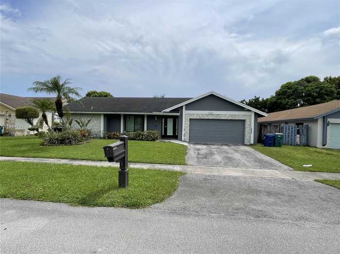 photo 1: 7140 NW 46th St, Lauderhill FL 33319