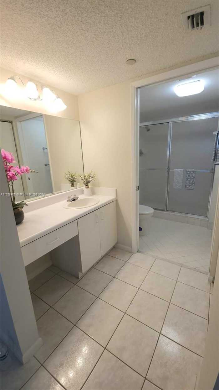 photo 1: 12551 SW 16th Ct Unit 209C, Pembroke Pines FL 33027