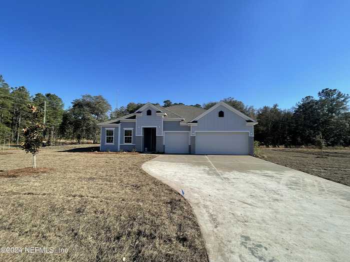 photo 1: 56310 CREEKSIDE Way, Callahan FL 32097