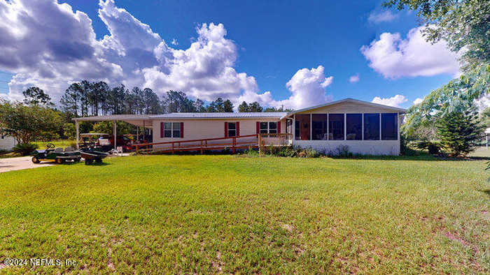 photo 1: 105 ST JOHNS Avenue, Satsuma FL 32189