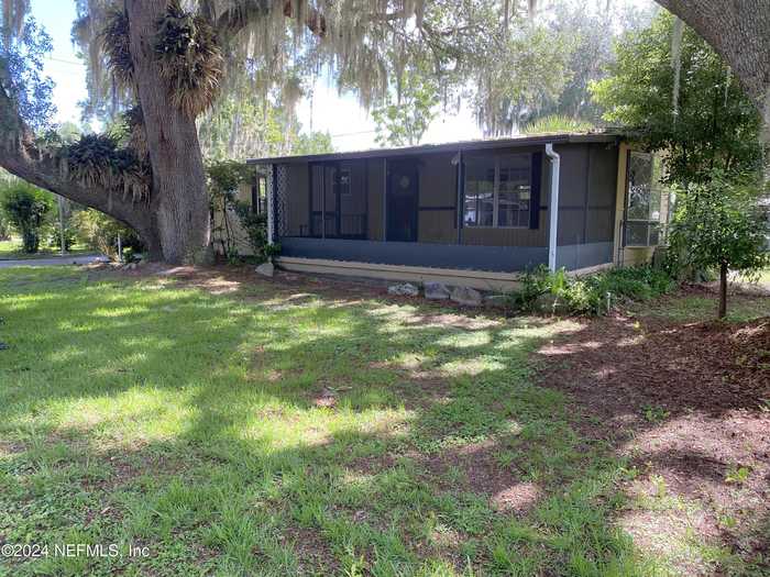 photo 1: 402 COVE Drive, Satsuma FL 32189