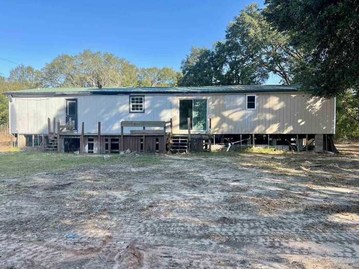 photo 1: 8281 Welcome Rd, Milton FL 32583