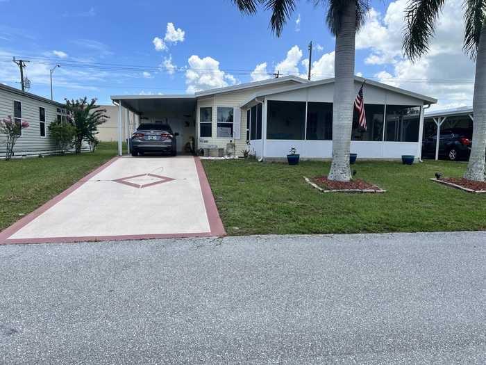 photo 1: 6555 Dulce Real Avenue, Fort Pierce FL 34951