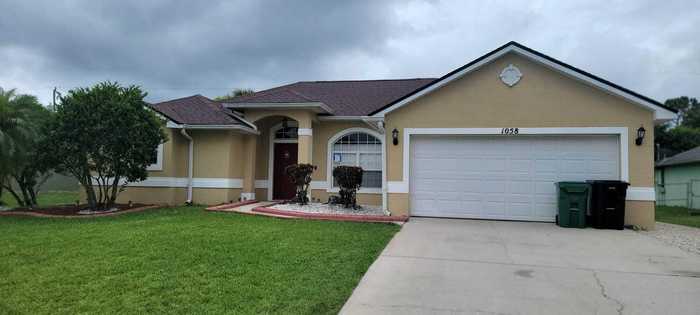 photo 1: 1058 Calmar Avenue, Port Saint Lucie FL 34953