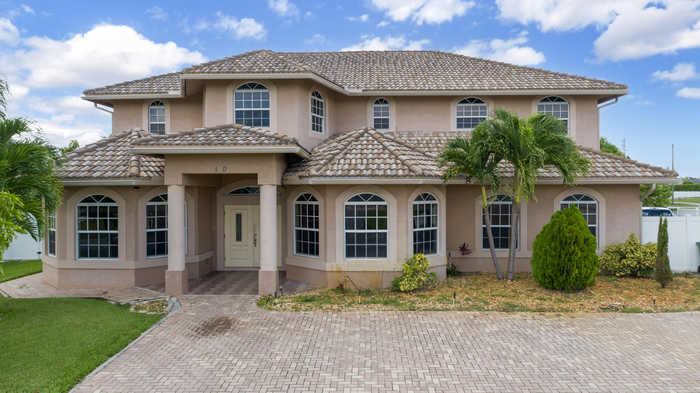 photo 1: 120 Sea Lion Road, Port Saint Lucie FL 34953