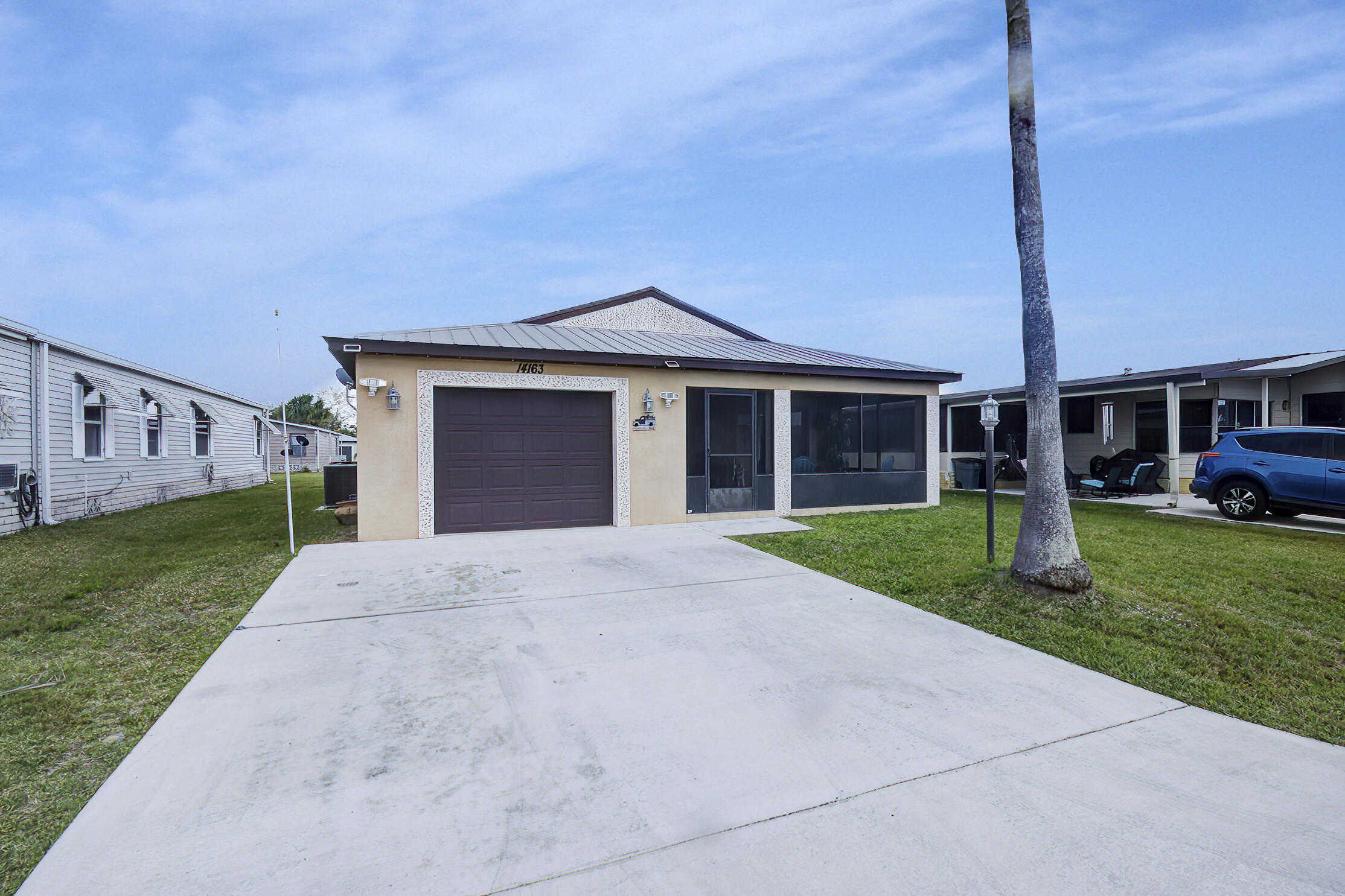 photo 1: 14163 Zorzal Avenue, Fort Pierce FL 34951