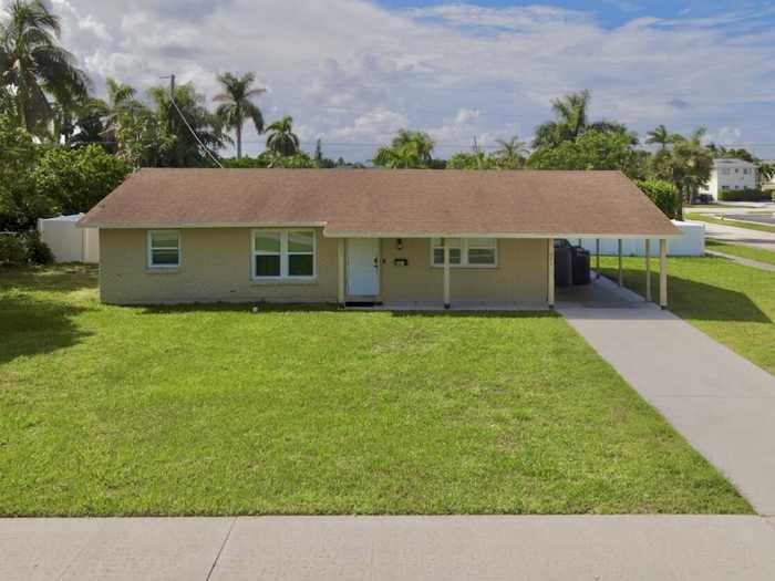 photo 1: 601 Jasmine Drive, Lake Park FL 33403